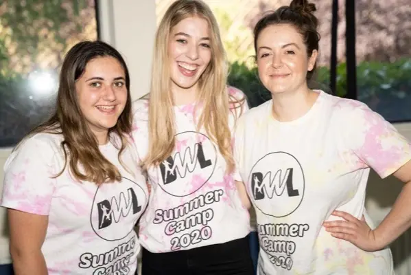 Teens and staff in tie-dye shirts