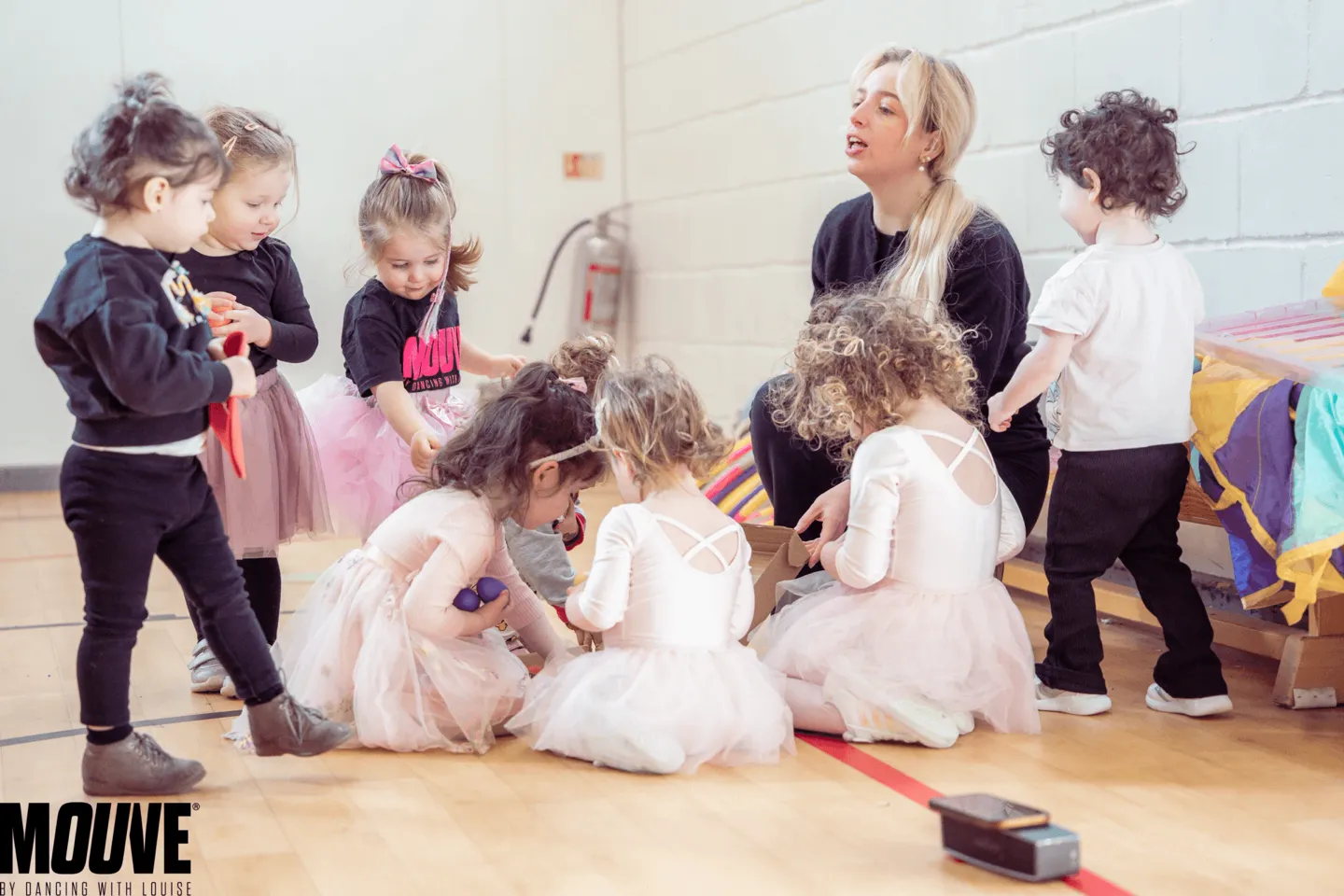 Teacher with a small group of toddlers during a Talented Tots class at MOUVE dance academy in Hendon NW4
