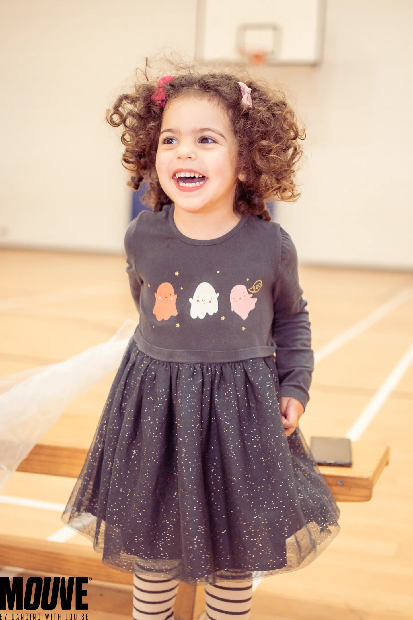 Happy toddler with curly hair laughing during a dance class at MOUVE dance academy in Hendon NW4